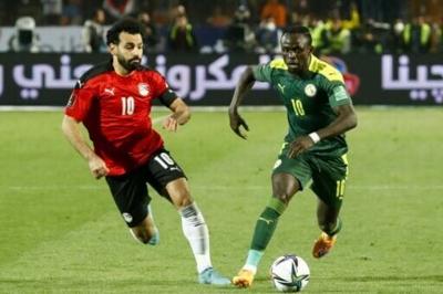 Mohamed Salah (left) and Sadio Mane playing against each other in a World Cup qualifying play-off in March 2022