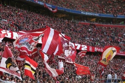 Bayern Munich fans cheer as their side win the Bundesliga title for the 35th time