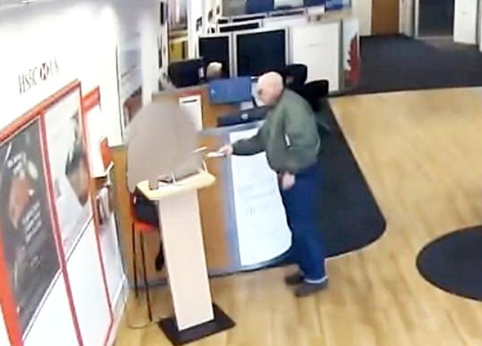Bizarre moment man tries to rob bank armed with a vape