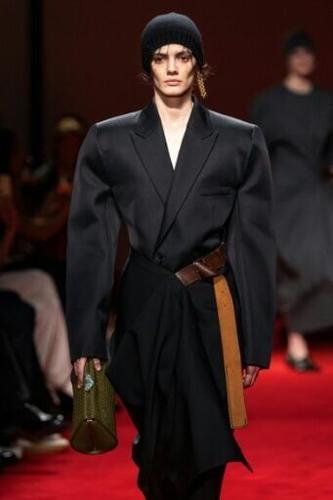 Armour-like coats from Bottega Veneta's Louise Trotter expressed the "brutalist" side of fashion capital of Milan.