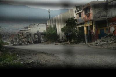 A deserted street in Port-au-Prince as seen from a police patrol vehicle