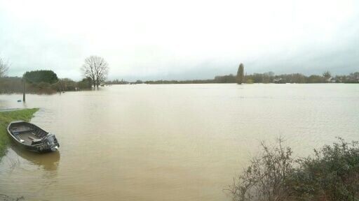 Flooded town in western France; man missing after canoe capsizes