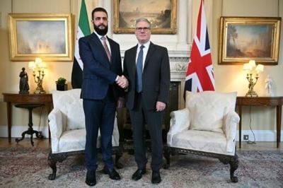 Syria's President Ahmed al-Sharaa is welcomed by Britain's Prime Minister Keir Starmer for talks at 10 Downing Street in central London