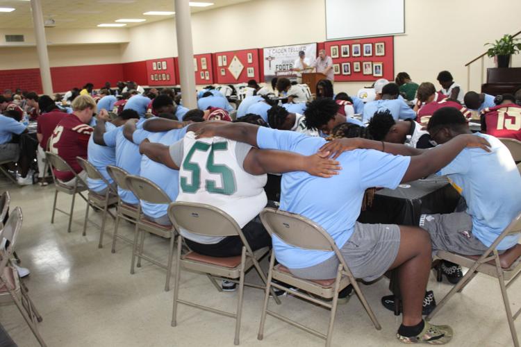 Praying football players