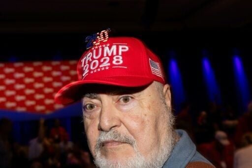 A man wears a hat reading 'Trump 2028' during the Conservative Political Action Conference (CPAC) in Grapevine, Texas, on March 26, 2026