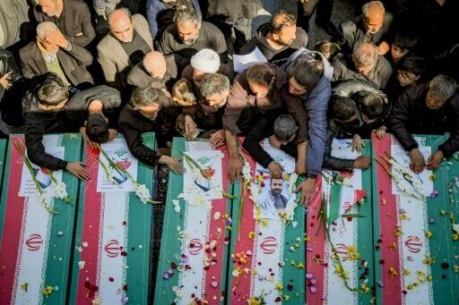 Mourners in the city of Qom attend the funeral of those killed in the US-Israeli war with Iran