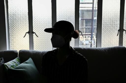 This photo taken on December 3, 2025, shows a woman during an interview with AFP in Quezon City, Metro Manila. Abortions are strictly outlawed in the mainly Catholic Philippines, forcing women to turn to a patchwork of providers operating in the online ...