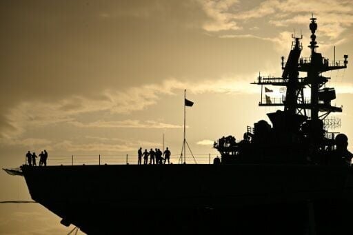 The USS Iwo Jima, seen here docked at Rafael Cordero Santiago Port of the America in Puerto Rico, is one of several warships deployed as part of a US campaign against drug trafficking from Latin America which Venezuela says aims to topple President Nico...