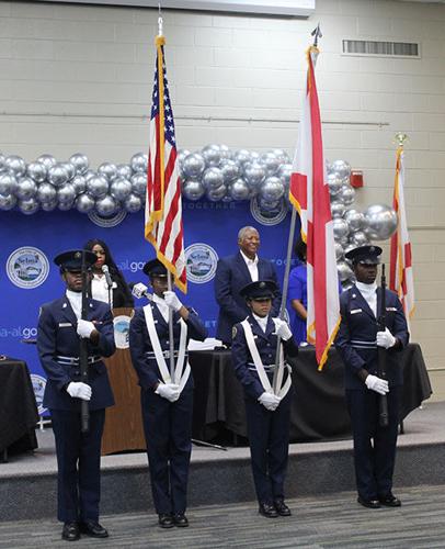 James Perkins Jr. in front of flags