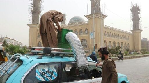 Fatigued Afghan taxi drivers take novel approach to AC
