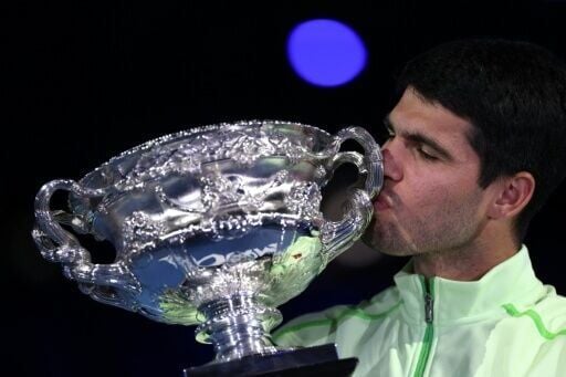 Spain’s Carlos Alcaraz celebrates with the Norman Brookes Challenge Cup