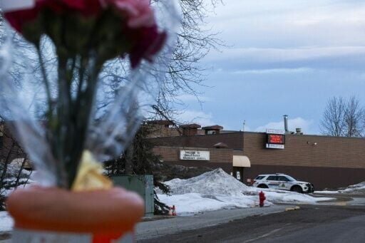 Flowers are placed near Tumbler Ridge Secondary school two days after the rural community experienced one of Canada's deadliest shootings