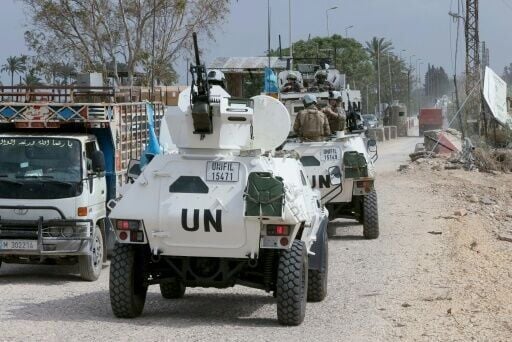 French peacekeepers with the United Nations Interim Force in Lebanon cross the Qasmiyeh Bridge towards Sidon and Beirut