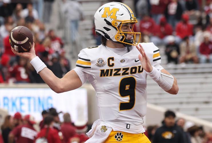 Mizzou quarterback Beau Pribula (9) warms up before the game