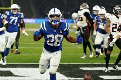 Indianapolis running back Jonathan Taylor celebrates scoring the winning touchdown in overtime to give the Colts an NFL victory over Atlanta at Berlin Olympic Stadium