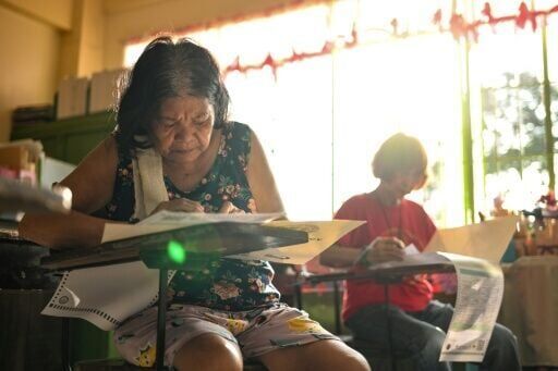 Sweltering Philippines votes with Marcos-Duterte feud centre stage