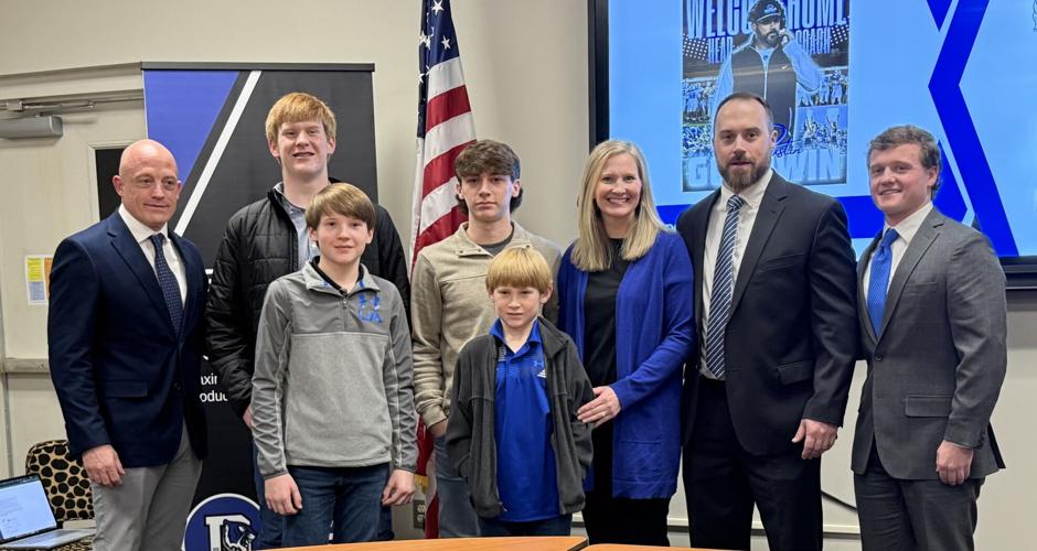 Demopolis new head football coach and family