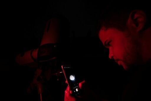 Stargazers marvel at 'Blood Moon', rare total lunar eclipse