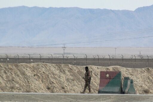 A security personnel stands guard at the Pakistan-Afghanistan border in Chaman on December 6, 2025, following overnight cross-border fire between the two countries