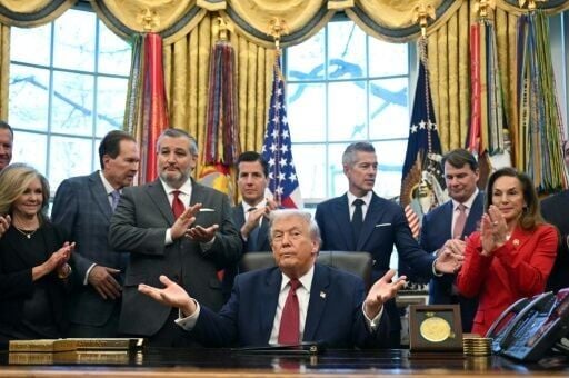 Trump was flanked in the Oval Office by the CEOs of Ford and Stellantis and a senior General Motors official, a show of buy-in from Detroit's "Big Three."