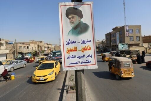 A poster flying in Baghdad's Sadr City district depicts influential Shiite cleric Moqtada Sadr and urges Iraqis to boycott parliamentary elections