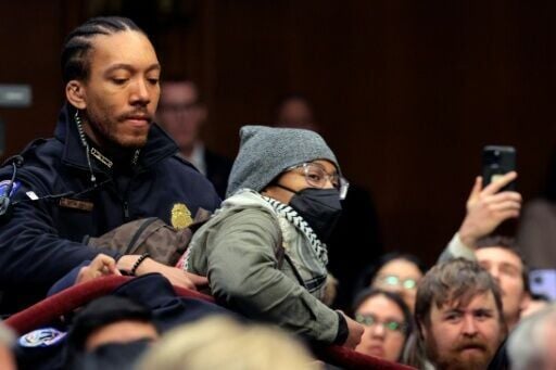 A protester is removed by US Capitol Police as Homeland Security Secretary Kristi Noem testifies before the Senate Judiciary Committee