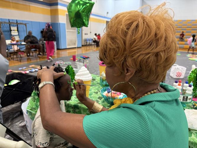 Face painting at school giveaway event
