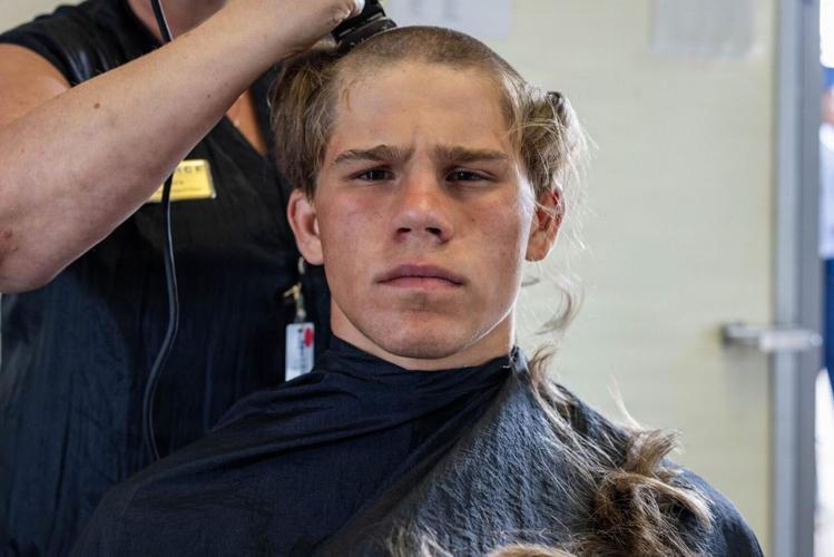 Shouting instructors and shaved heads greet new US Air Force cadets in Colorado