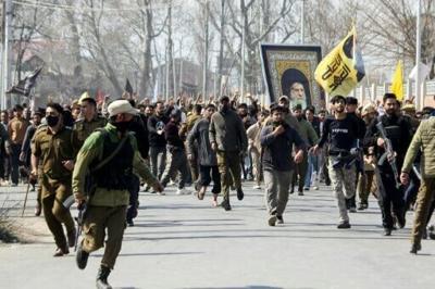 Shia Muslim demonstrators hold a portrait of Iran's late supreme leader Ayatollah Ali Khamenei in Srinagar on March 2, 2026 after restrictions were imposed amid protests over his death by US-Israel strikes