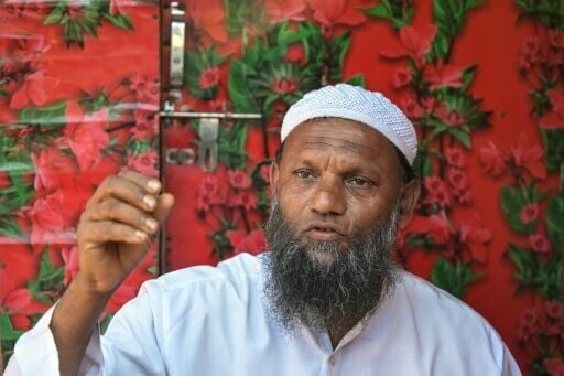 Rohingya refugee Jamil Ahmad sells part of his monthly food rations to pay for his kids' tuition fees