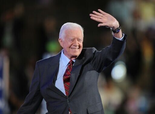 Jimmy Carter briefly unites US as presidents attend funeral