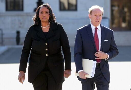Federal Reserve Governor Lisa Cook (L) and attorney Abbe Lowell leave the US Supreme Court