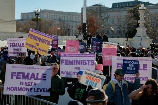 Demonstrators gathered outside the US Supreme Court as the justices heard challenges to state bans on transgender athletes in girls' and women's sports