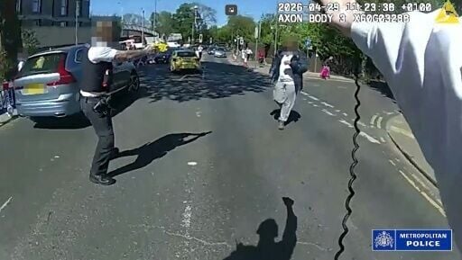 Police pointing their tasers at the suspected attacker