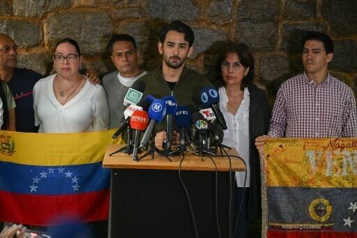 Ramon Guanipa, son of former National Assembly vice president Juan Pablo Guanipa, speaks to reporters following his father's re-arrest in Caracas
