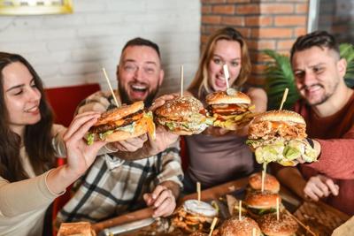 Fast food chains and restaurants nationwide are celebrating with buy-one-get-one deals, discounts and free cheeseburgers with minimum purchases.