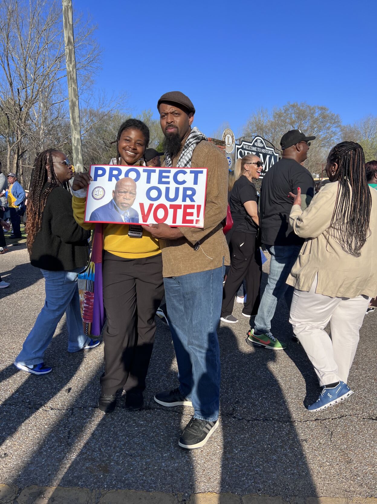 Two people with sign at Jubilee