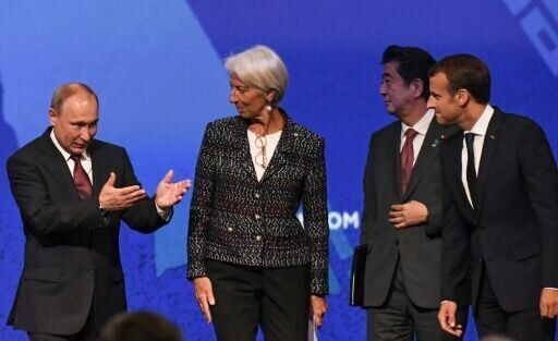 Putin T-shirts, robots and the Taliban -- but few Westerners at Russia's Davos