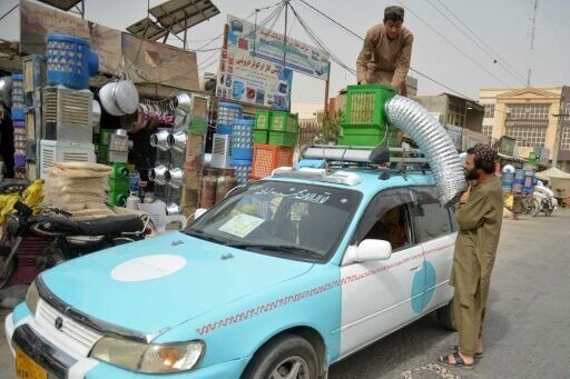 Fatigued Afghan taxi drivers take novel approach to AC