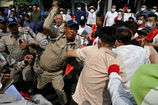 Chinese and Cambodian nationals believed to be Huione Pay creditors clash with police and security personnel during a protest demanding their accounts be unfrozen in Phnom Penh in April