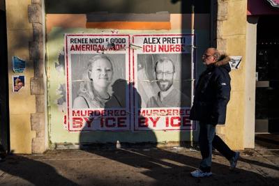 Posters memorialize Renee Good and Alex Pretti, two white Minneapolis residents killed by federal agents.