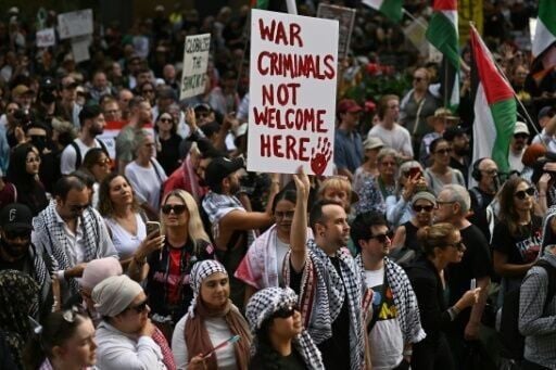 Pro-Palestinian protesters take part in a demonstration against Israeli President Isaac Herzog's visit to Australia in Sydney on February 9, 2026.