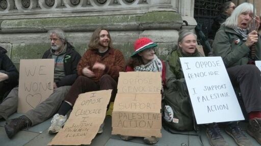 Palestine Action supporters celebrate the group's legal victory outside court