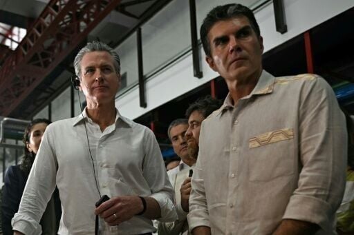 California Governor Gavin Newsom (L) visits a dock area with Helder Barbalho, the governor of Brazil's Para state, in Belem.