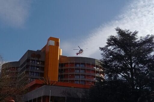 A helicopter leaves Sion hospital, which was overwhelmed by the number of severe burn victims