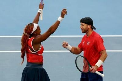Coco Gauff and Christian Harrison celebrate defeating Greece’s Maria Sakkari and Stefanos Tsitsipas