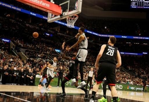 San Antonio's Victor Wembanyama swats away a shot by Tari Eason in the Spurs drubbing of the Houston Rockets