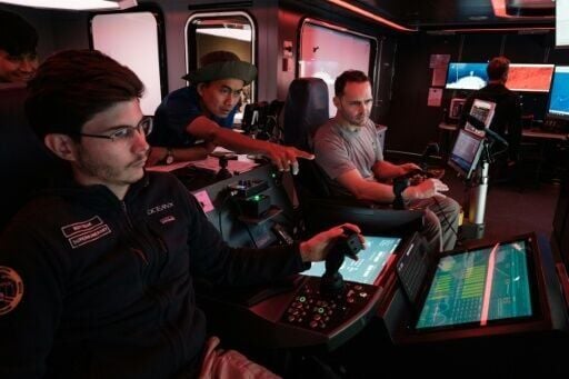 For deeper exploration, scientists steer a remotely operated vehicle from a futuristic-looking 'mission control'