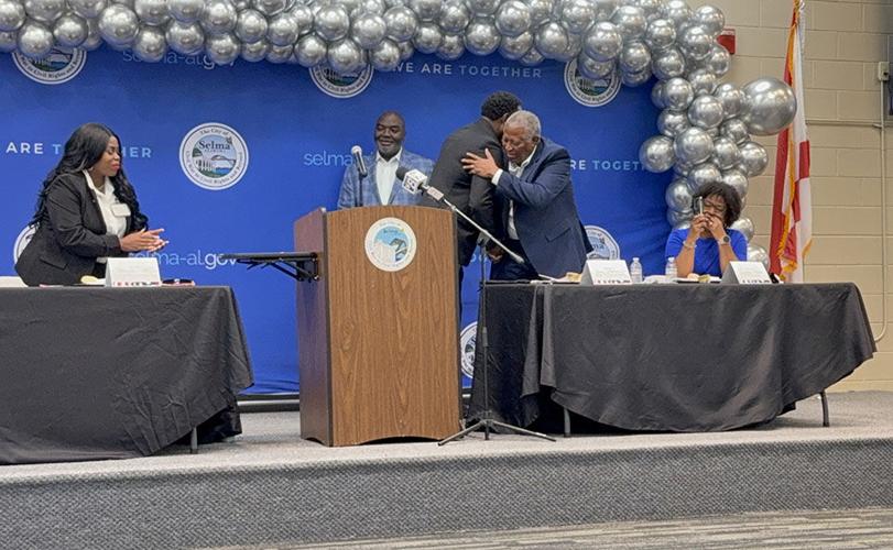 Mayor hugs Kennard Randolph