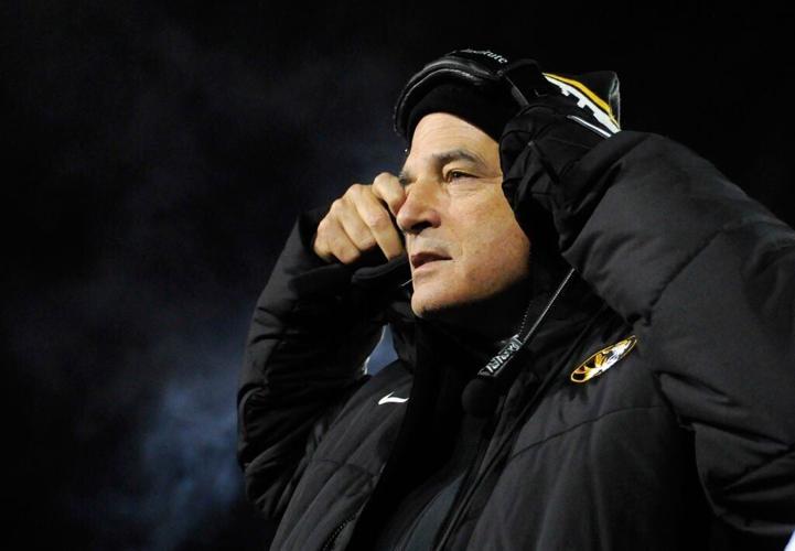 Gary Pinkel puts on his headset (copy)